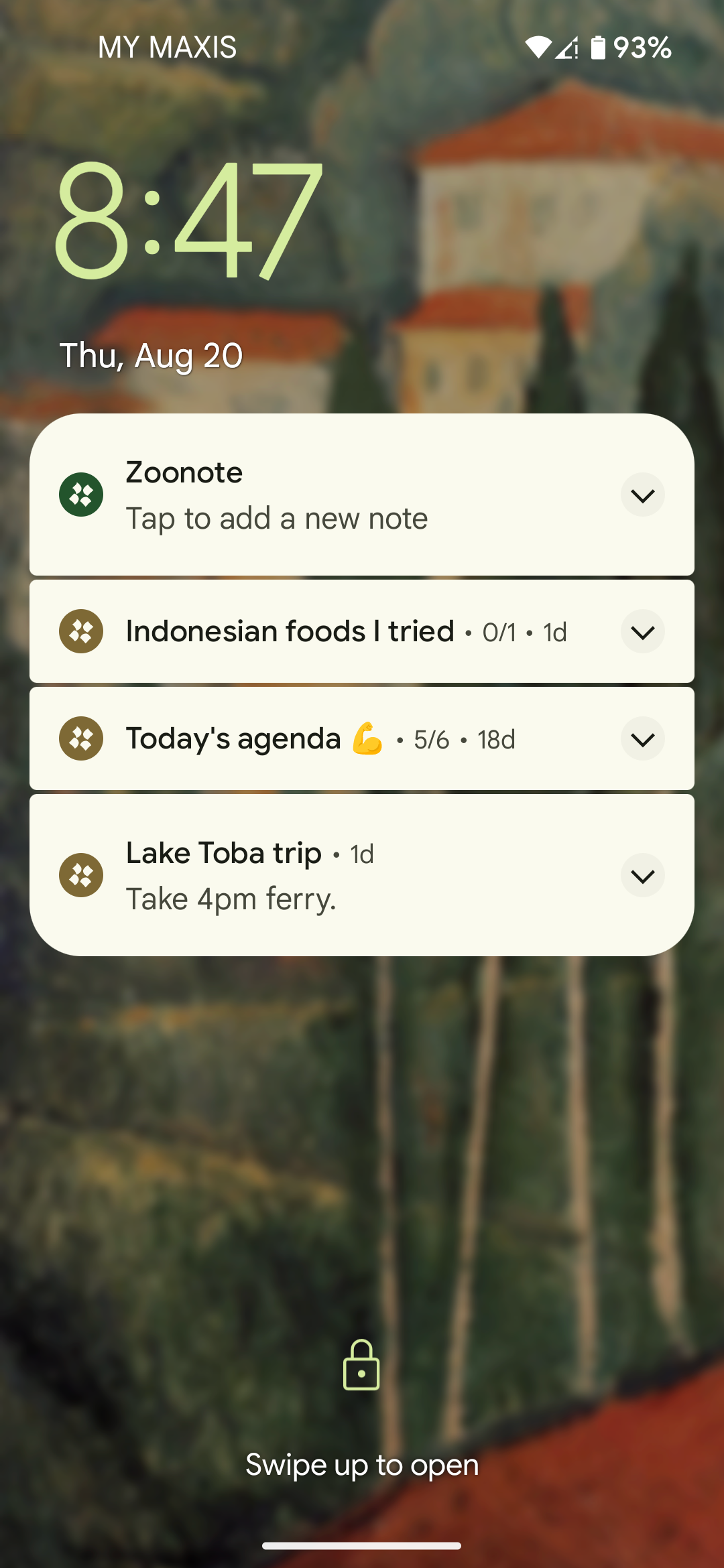 A smartphone lock screen showing the time 8:47 and four Zoonote notifications: "Tap to add a new note," "Indonesian foods I tried," "Today's agenda 💪," and "Lake Toba trip" with the note "Take 4pm ferry." A blurred scenic landscape appears in the background.
